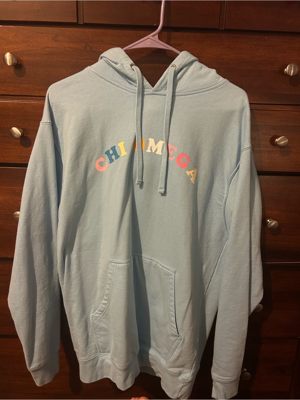 Light Blue Hoodie with 'CHI OMEGA' Multicolor Arch